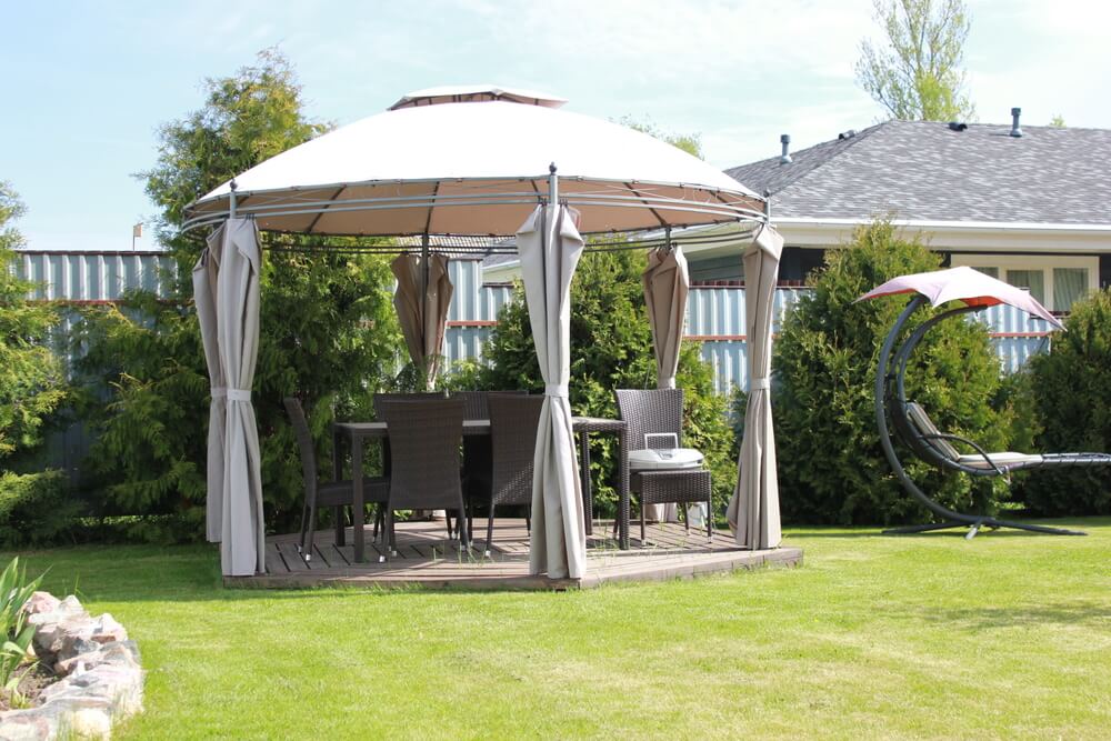 Cozy garden gazebo designed to maximize a small backyard space