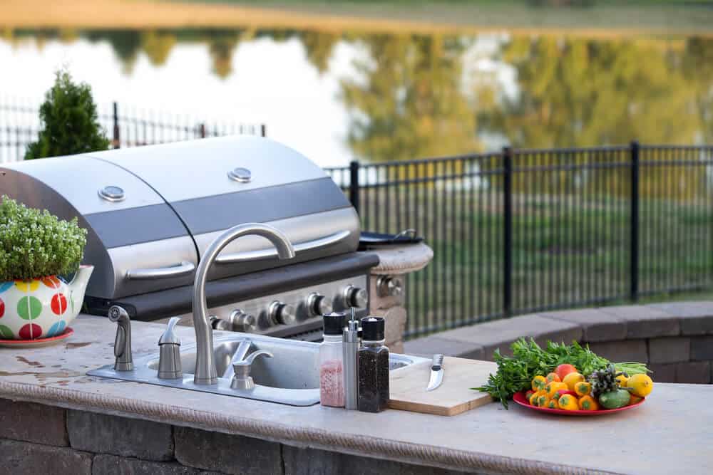 Built-in grill and smoker in a custom outdoor kitchen