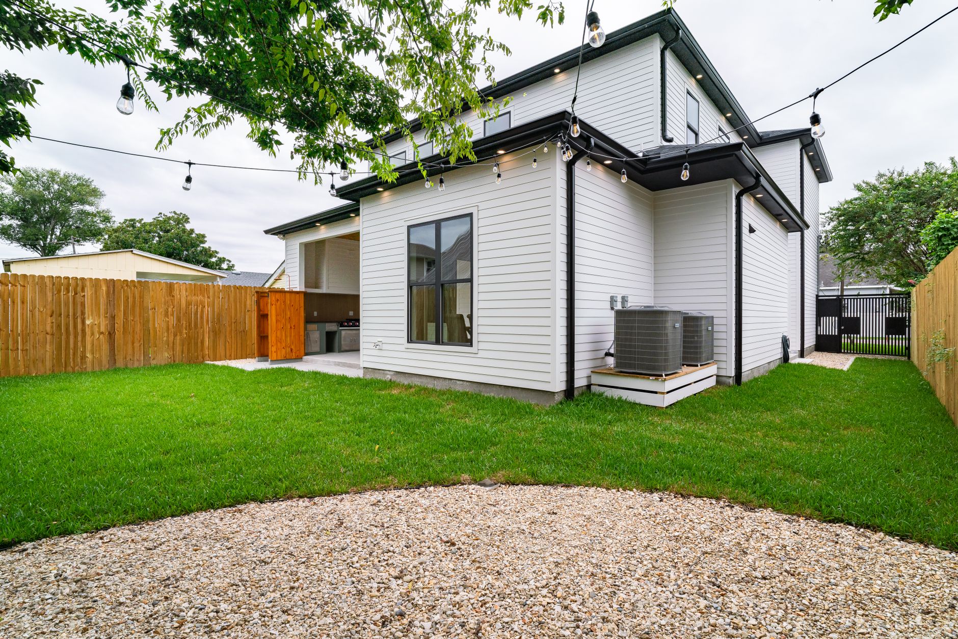 Covered patio with seating behind a home in Kenner