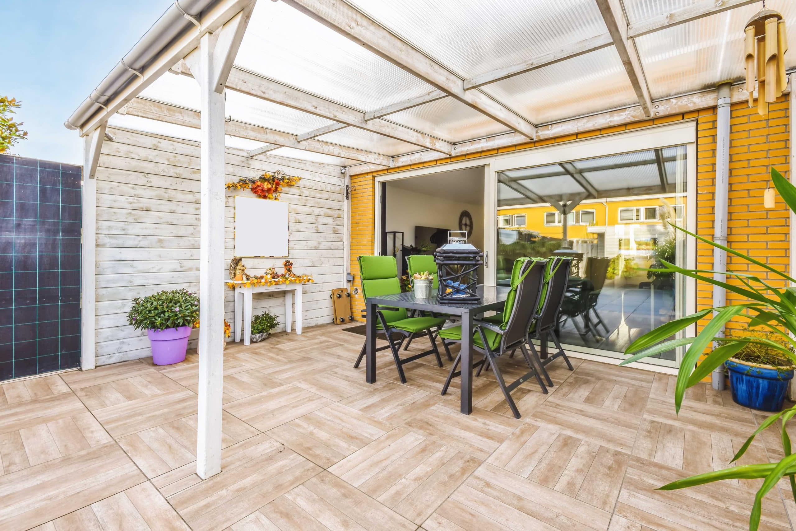Modern pergola design expanding an outdoor living area with climbing plants for shade