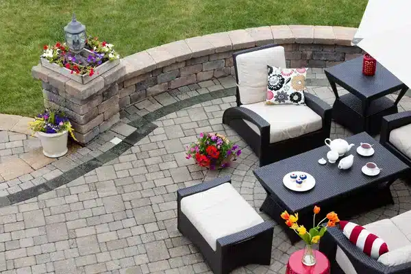 Outdoor patio furniture arranged on a New Orleans backyard patio