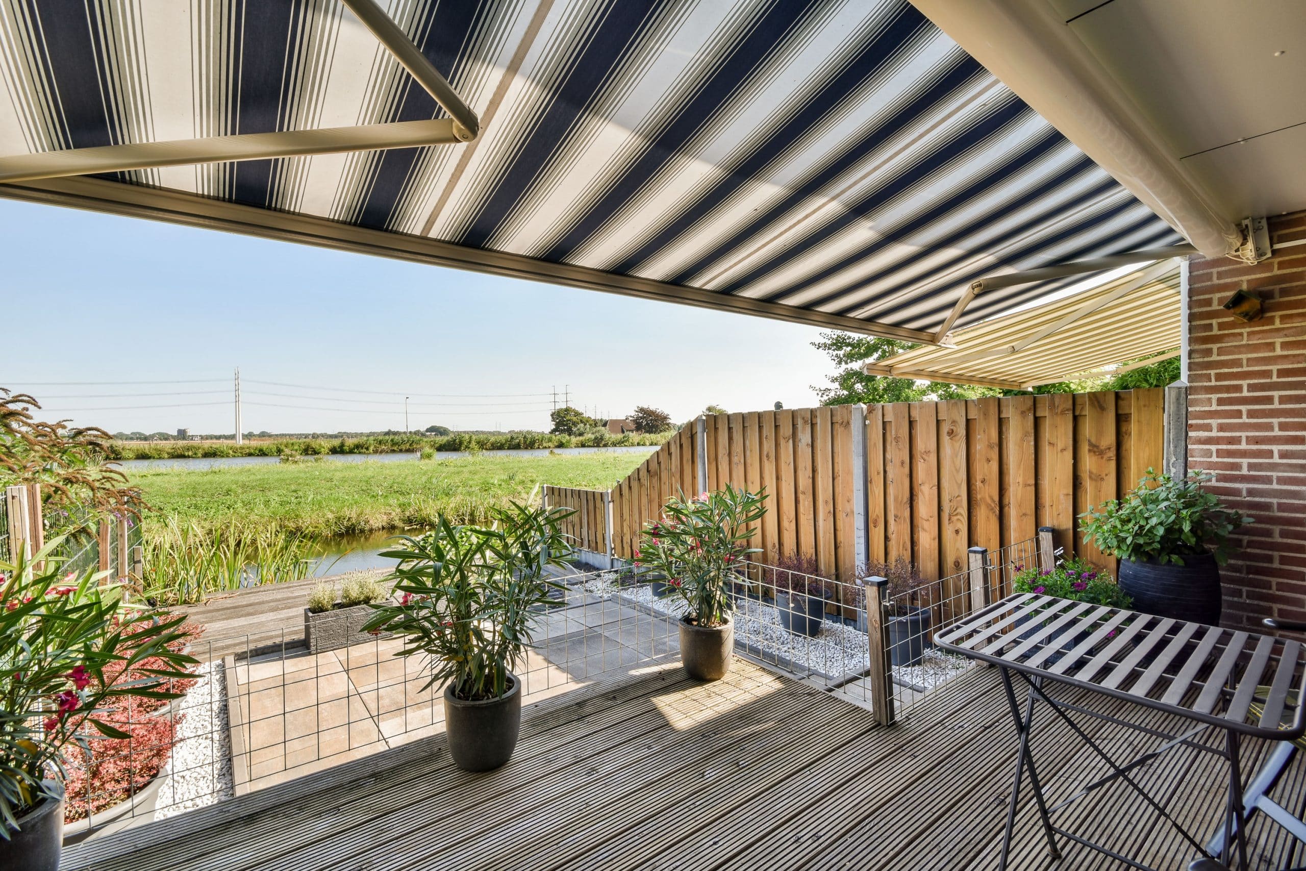 Paved patio with a seating area and garden bed, a DIY-friendly patio layout