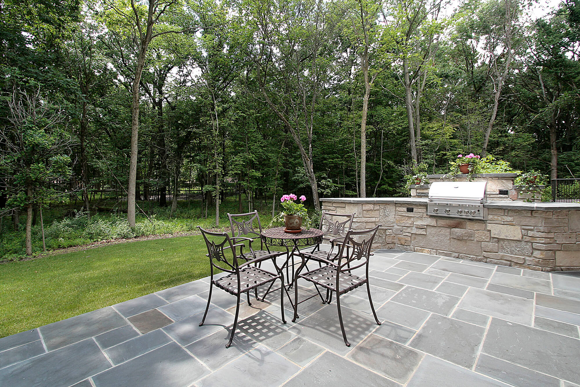 Custom stone patio tailored to a homeowner's outdoor living needs